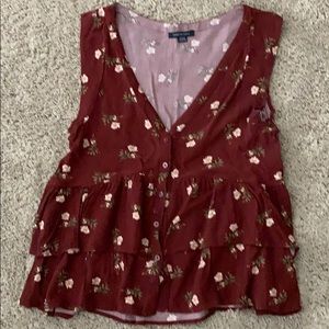 Floral-burgundy colored ruffled button up tank top
